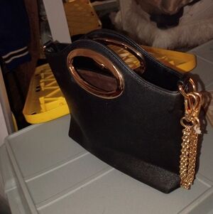 Elegant Black Handbag with Gold Accents
